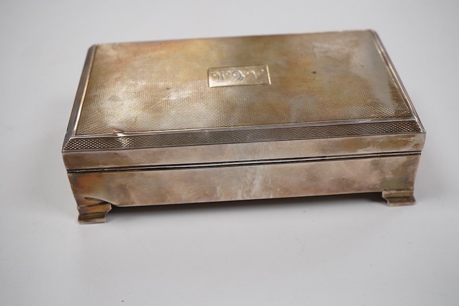 An Elizabeth II part engine turned silver rectangular cigarette case, by S.R. Rose & Son, London, 1955, with engraved initials, 15cm.